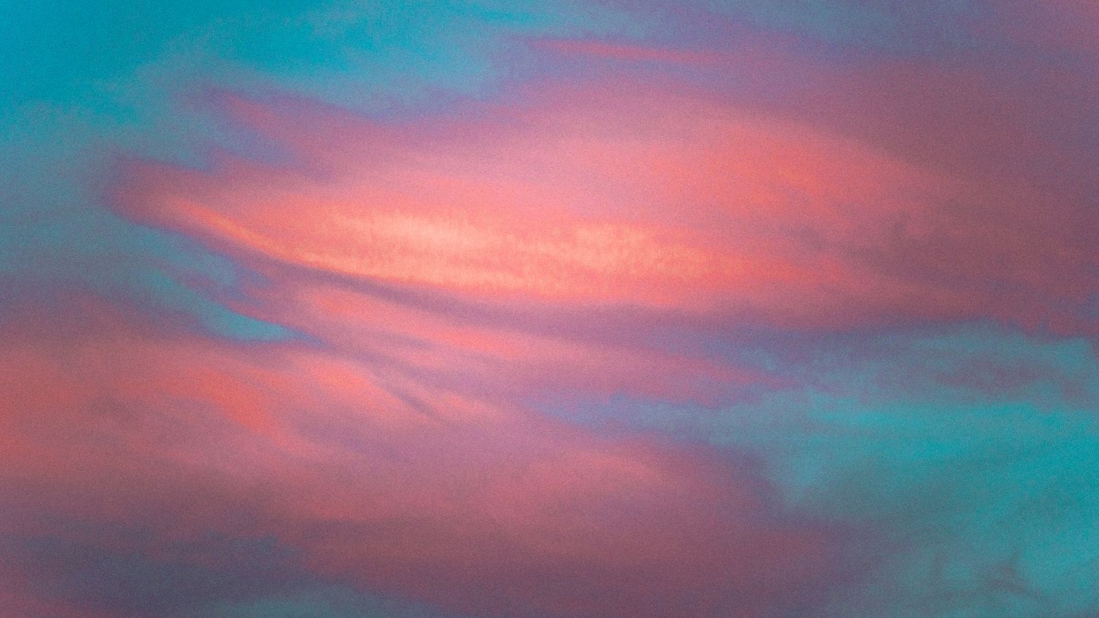 soft pink and blue clouds at sunrise, abstract sky scene