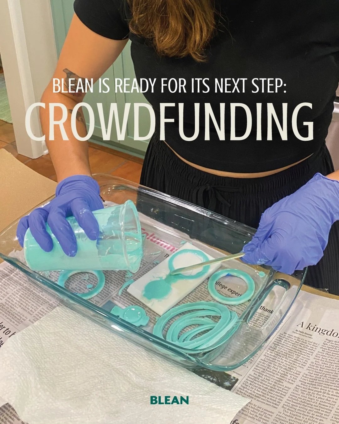 Gloved hands lifting freshly cast teal silicone parts out of a glass tray on a newspaper-covered bench, from a Blean post announcing its crowdfunding step